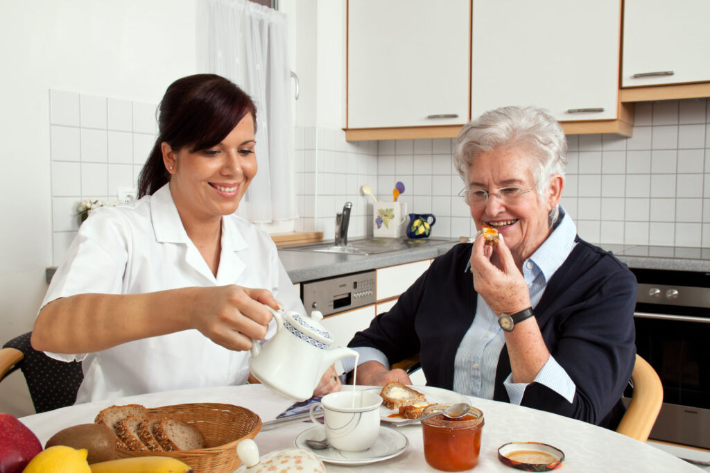 fika a woman pouring milk into a cup of tea
